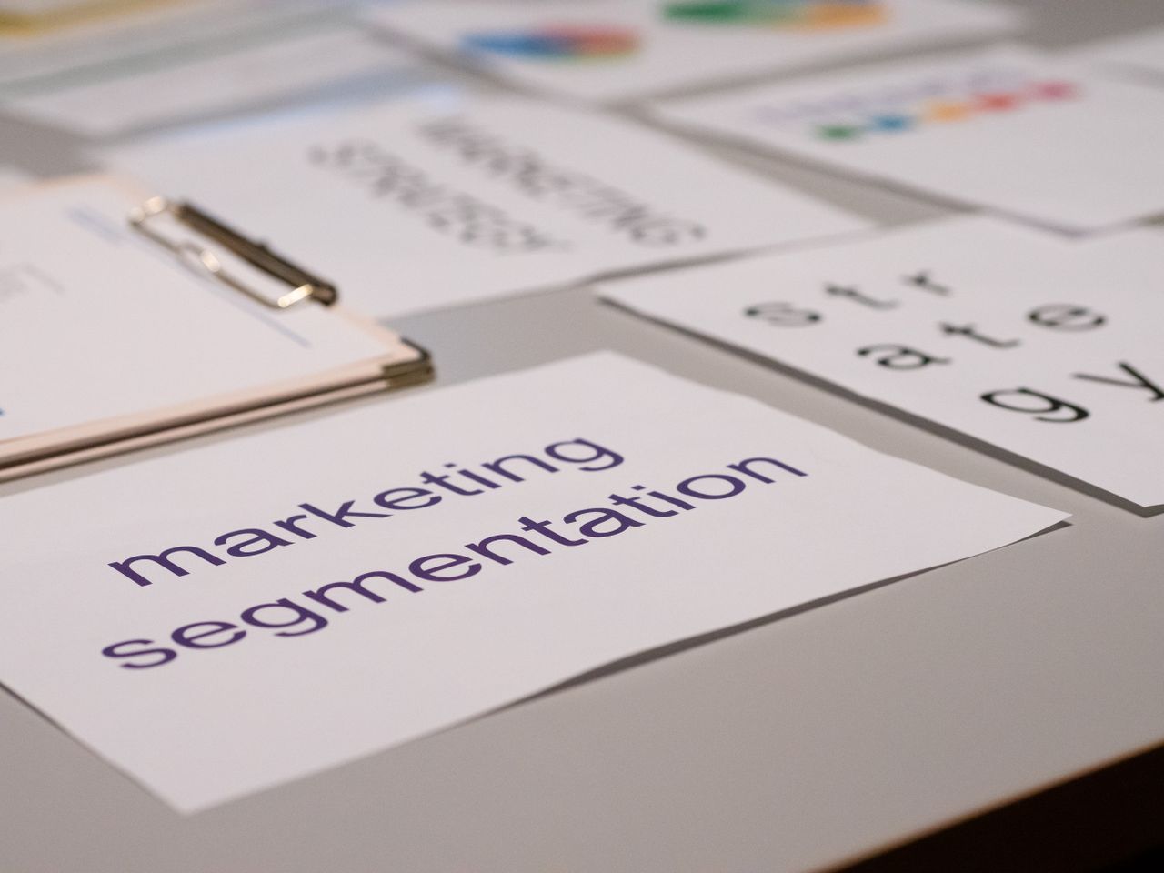 home-hero-bg Close-up of various marketing documents on a desk, perfect for business and strategy discussions.