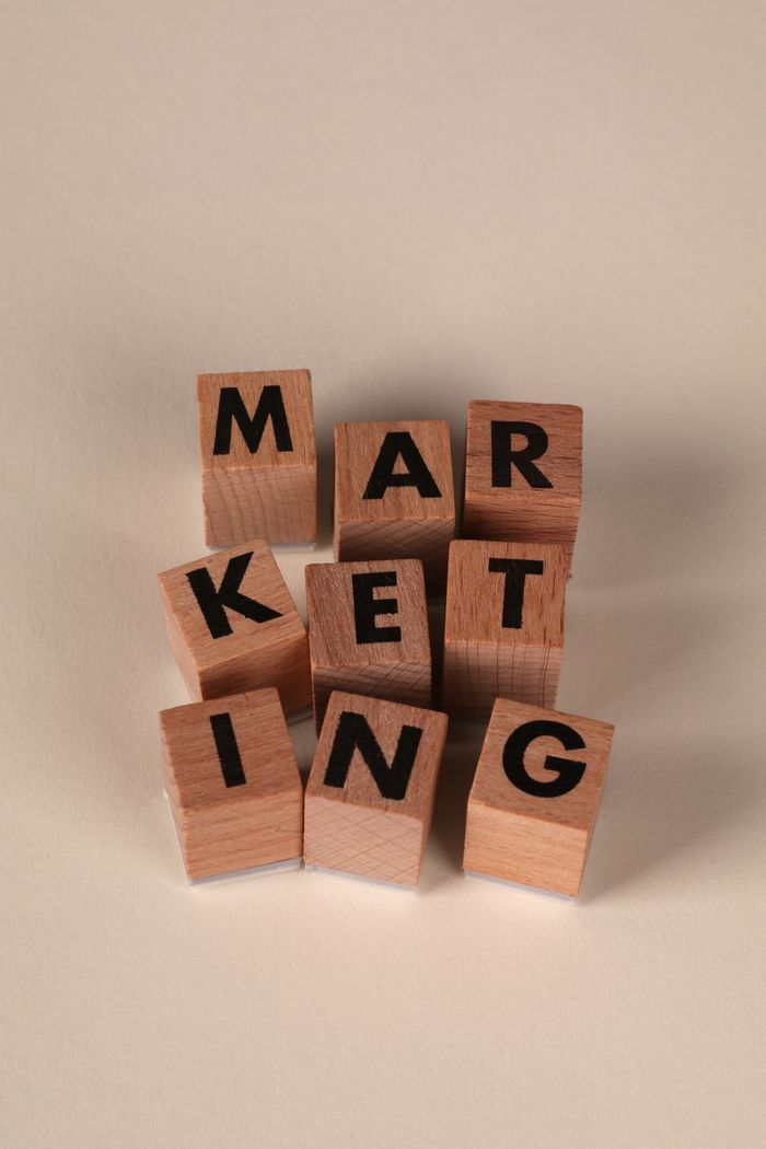 home-services-02 Wooden blocks arranged to spell MARKETING on a neutral background.